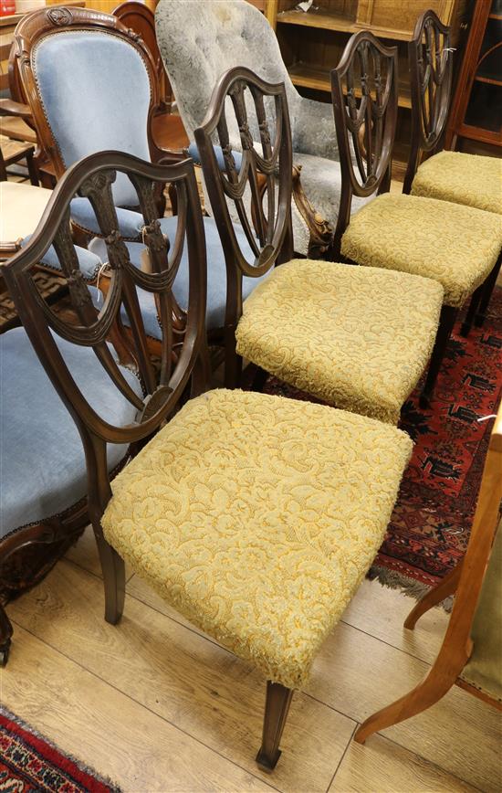 A set of four Hepplewhite style mahogany dining chairs